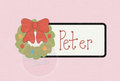 Personalized name tag with a red bow and green wreath on a pink background, labeled as an STL digital file.
